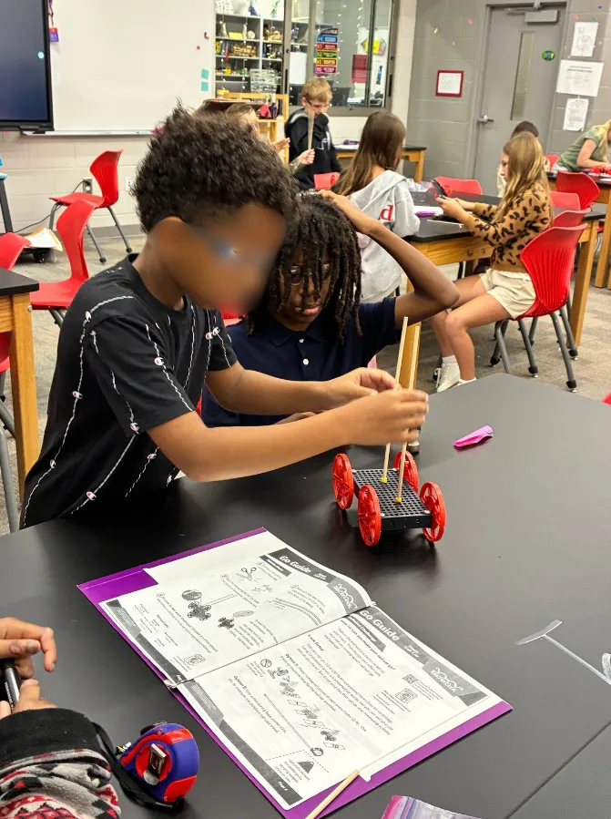 A student’s physical sail car build, built before moving to Mars Rover in Qweebi.