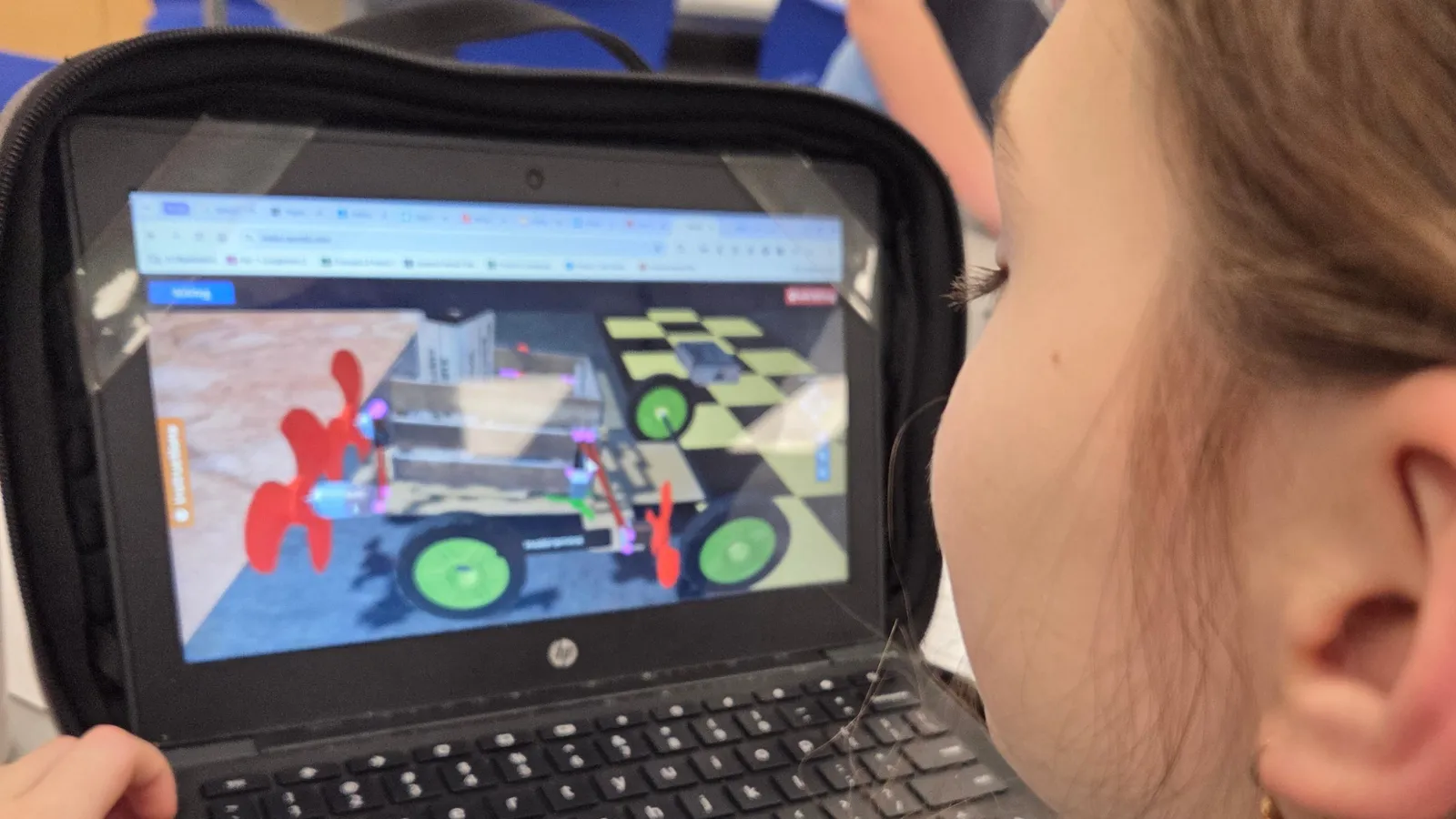 A middle schooler building a Mars Rover Transporter project in Qweebi's online makerspace.