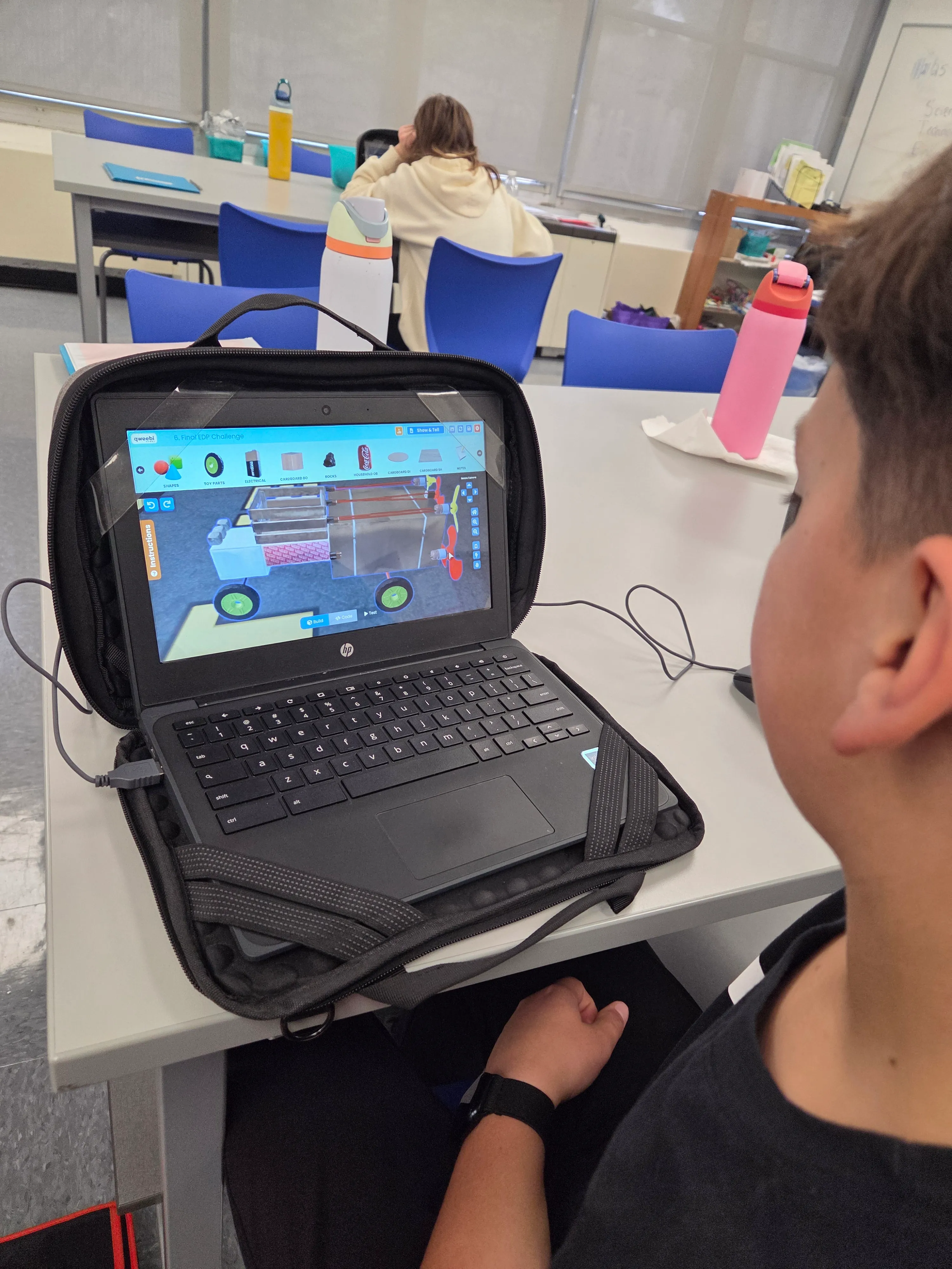 A student working on a Mars Rover build in Regina’s classroom.